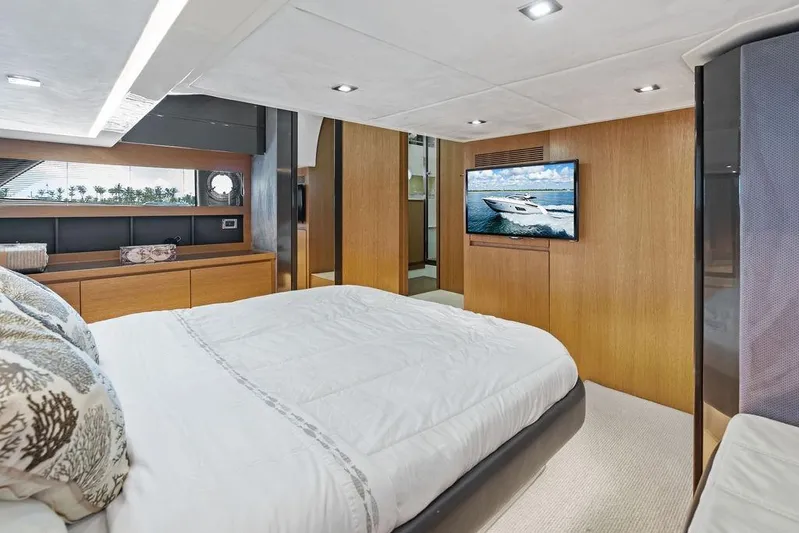  Yacht Photos Pics Luxurious bedroom interior of 2013 Azimut Atlantis 48 yacht with modern decor and TV.