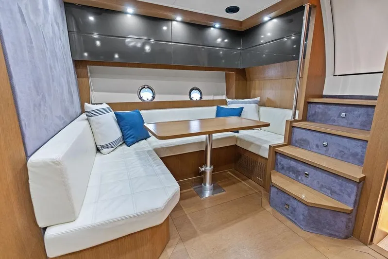  Yacht Photos Pics Luxurious interior of 2013 Azimut Atlantis 48 yacht with elegant seating and dining area.