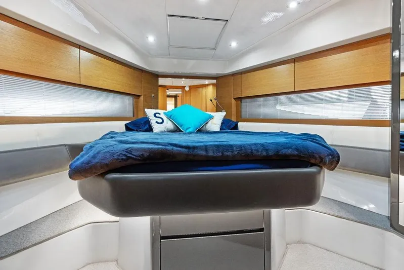  Yacht Photos Pics Luxurious interior of 2013 Azimut Atlantis 48 yacht with modern bedding and wood accents.