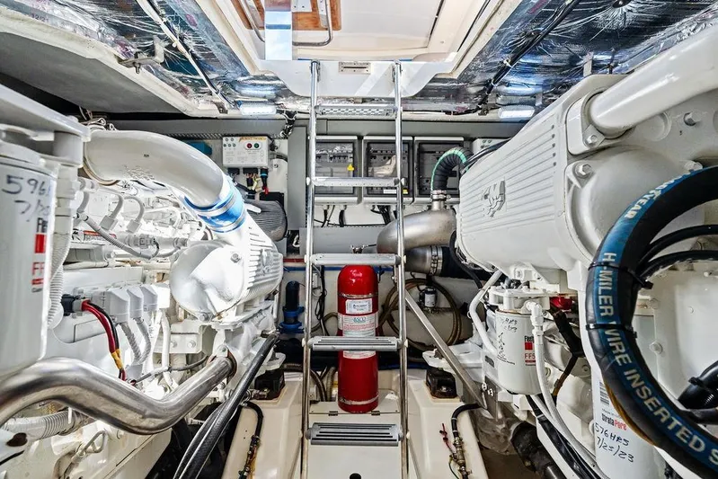  Yacht Photos Pics Engine room of 2013 Azimut Atlantis 48 yacht, featuring machinery and fire extinguisher.