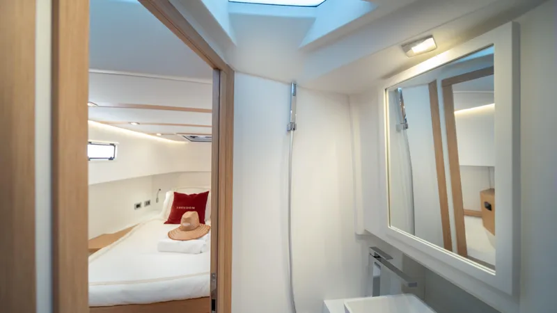 Freedom Yacht Photos Pics Luxurious interior of 2023 Pardo Yachts 38, featuring a cozy bedroom and modern bathroom.