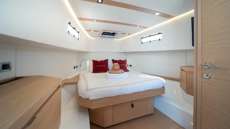 Freedom Yacht Photos Pics Luxurious cabin interior of 2023 Pardo Yachts 38 with modern design and cozy bedding.