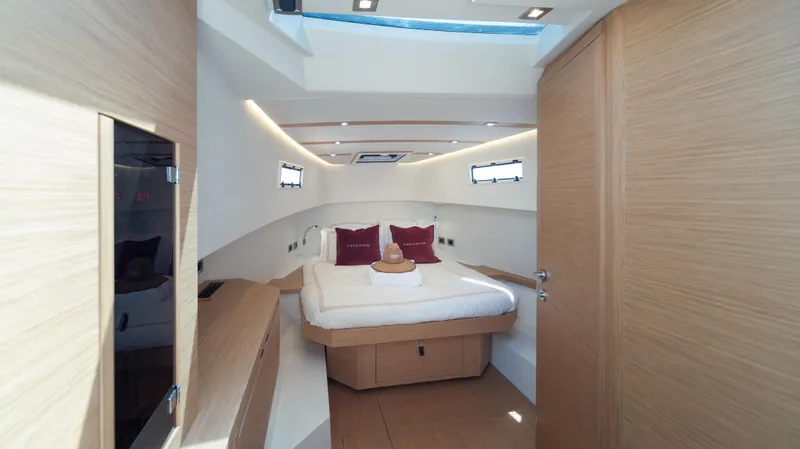 Freedom Yacht Photos Pics Luxurious cabin interior of 2023 Pardo Yachts 38, featuring modern design and cozy bedding.
