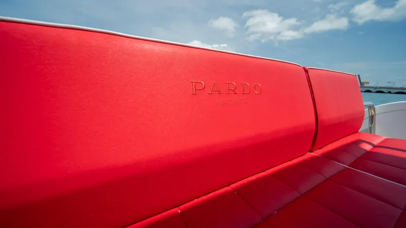 Freedom Yacht Photos Pics Red leather seating on 2023 Pardo Yachts 38 under blue sky.