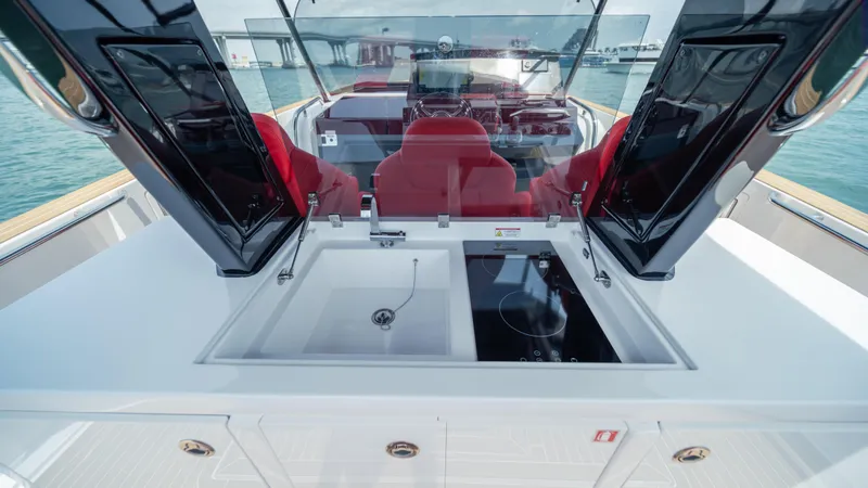 Freedom Yacht Photos Pics 2023 Pardo Yachts 38 interior with sink and stove, featuring red seating and modern design.