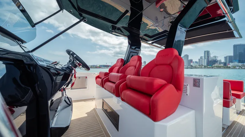 Freedom Yacht Photos Pics 2023 Pardo Yachts 38 interior with red seats and city skyline view.