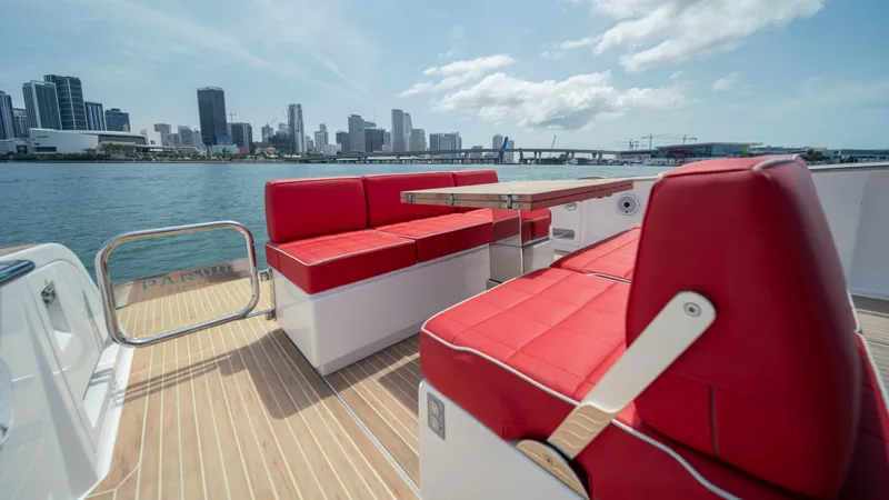 Freedom Yacht Photos Pics 2023 Pardo Yachts 38 with red seating, city skyline in background.