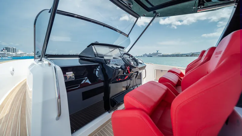 Freedom Yacht Photos Pics 2023 Pardo Yachts 38 with red seats and sleek dashboard on open water.