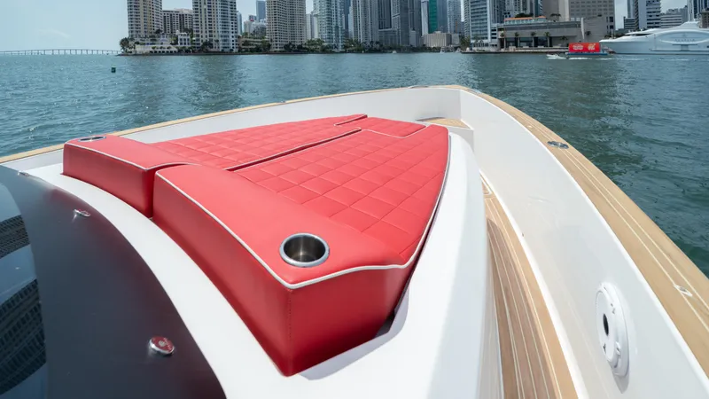 Freedom Yacht Photos Pics 2023 Pardo Yachts 38 with red seating, docked near city skyline.