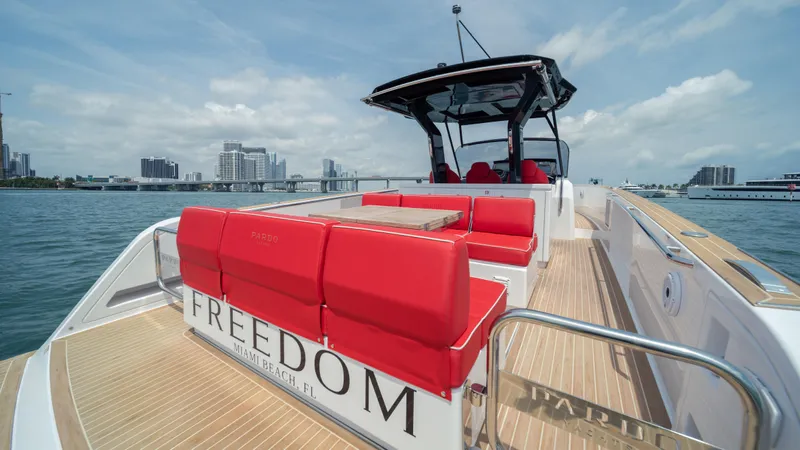 Freedom Yacht Photos Pics 2023 Pardo Yachts 38 with red seating, cruising on a sunny day.