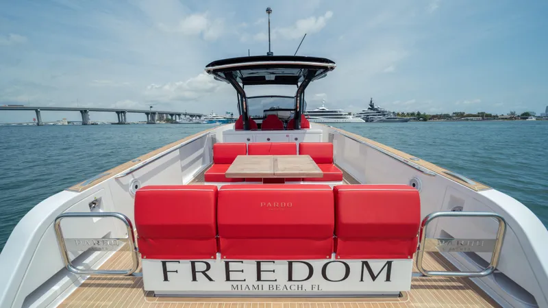 Freedom Yacht Photos Pics 2023 Pardo Yachts 38 with red seating, "Freedom" label, docked in Miami Beach.