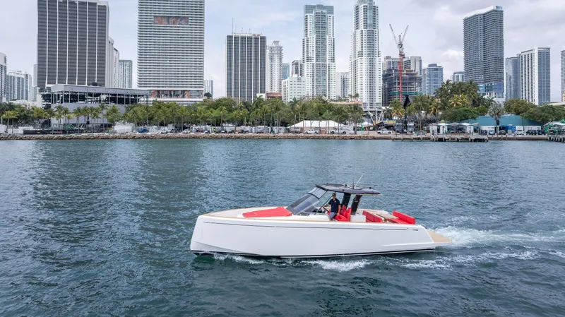 Freedom Yacht Photos Pics 2023 Pardo Yachts 38 cruising in urban waterfront with city skyline backdrop.