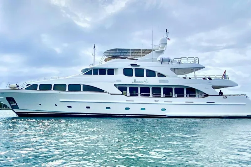 Mamma Mia Yacht Photos Pics Luxury 2007 Benetti 120 Classic yacht on serene water under cloudy sky.