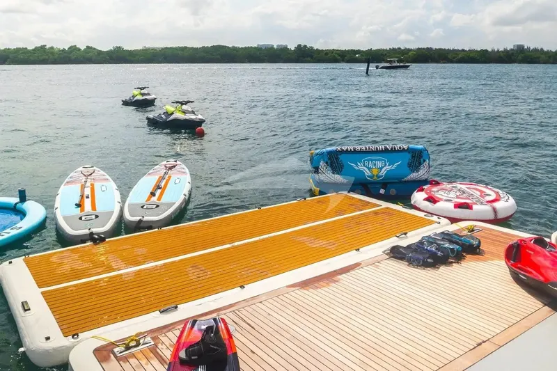 Mamma Mia Yacht Photos Pics Water sports equipment on Benetti 120 Classic yacht deck, 2007 model, with jet skis and paddleboards.