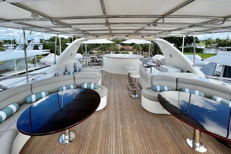 Mamma Mia Yacht Photos Pics Luxurious 2007 Benetti 120 Classic yacht deck with elegant seating and bar area.