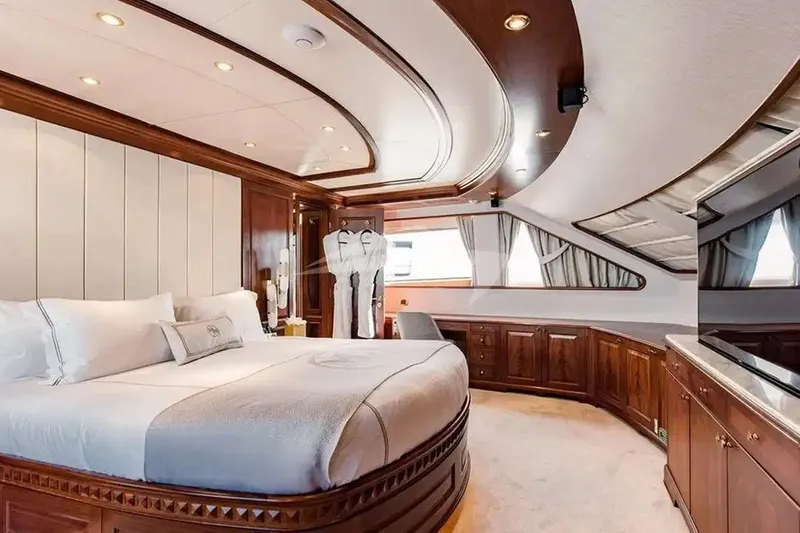Mamma Mia Yacht Photos Pics Luxurious bedroom interior of 2007 Benetti 120 Classic yacht with elegant wood finishes.