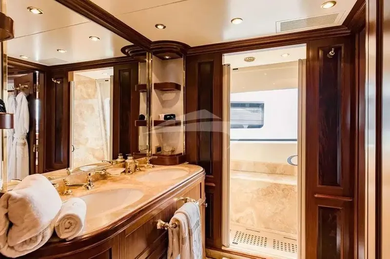Mamma Mia Yacht Photos Pics Luxurious bathroom interior on 2007 Benetti 120 Classic yacht, featuring elegant wood and marble finishes.