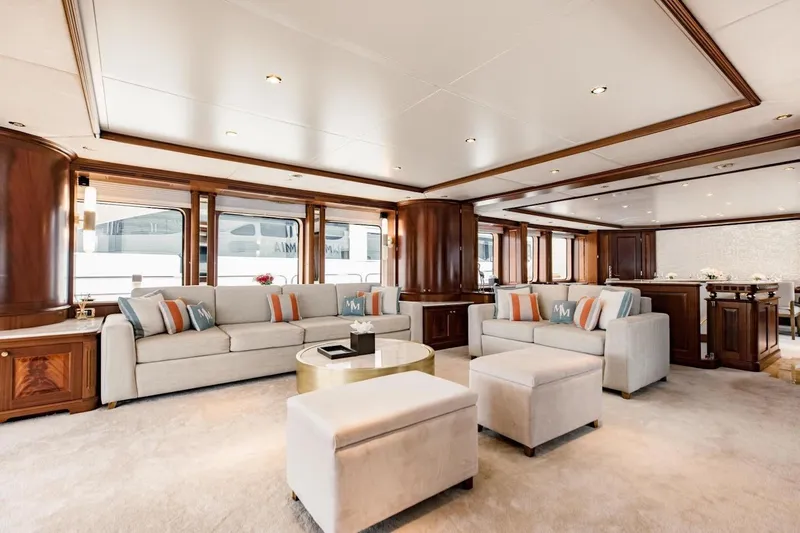 Mamma Mia Yacht Photos Pics Luxurious interior of 2007 Benetti 120 Classic yacht with elegant seating and wooden accents.