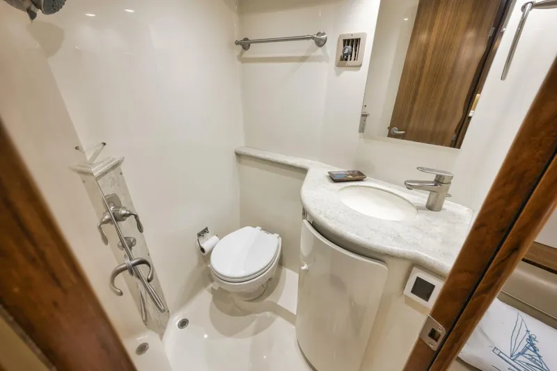 Blondie Yacht Photos Pics Luxurious bathroom in 2012 Viking 42 Open yacht, featuring modern fixtures and elegant design.