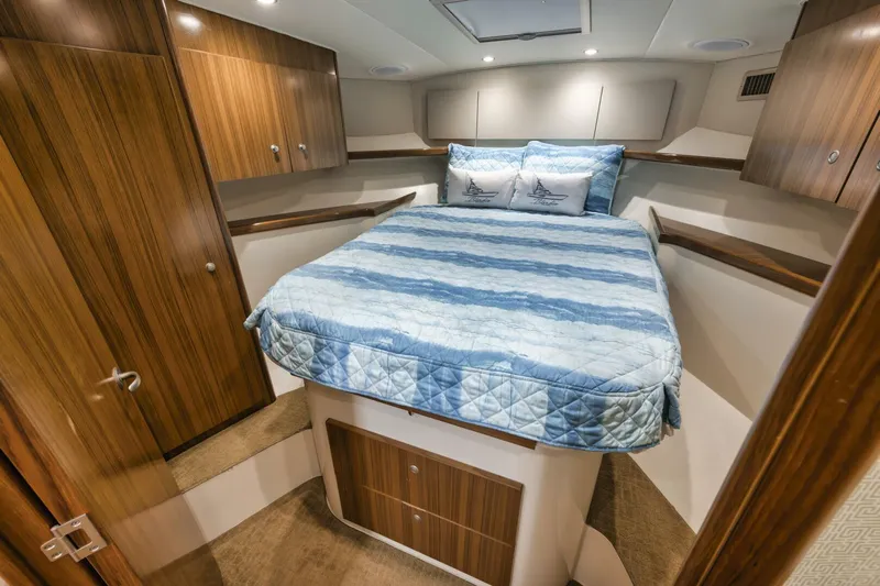 Blondie Yacht Photos Pics 2012 Viking 42 Open yacht cabin with cozy bed and wooden cabinetry.