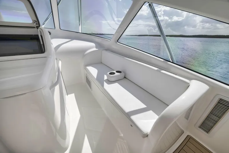Blondie Yacht Photos Pics Luxurious interior of 2012 Viking 42 Open yacht with white seating and ocean view.