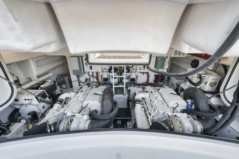 Blondie Yacht Photos Pics Engine room of 2012 Viking 42 Open yacht, showcasing dual engines and mechanical systems.
