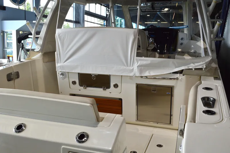  Yacht Photos Pics 2024 Boston Whaler 350 Realm interior, featuring sleek seating and modern amenities.