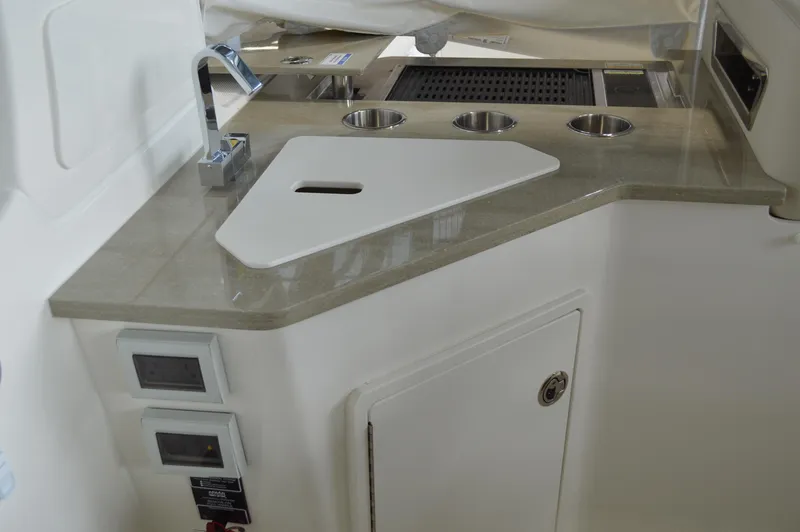  Yacht Photos Pics 2024 Boston Whaler 350 Realm boat interior with sleek countertop and modern fixtures.