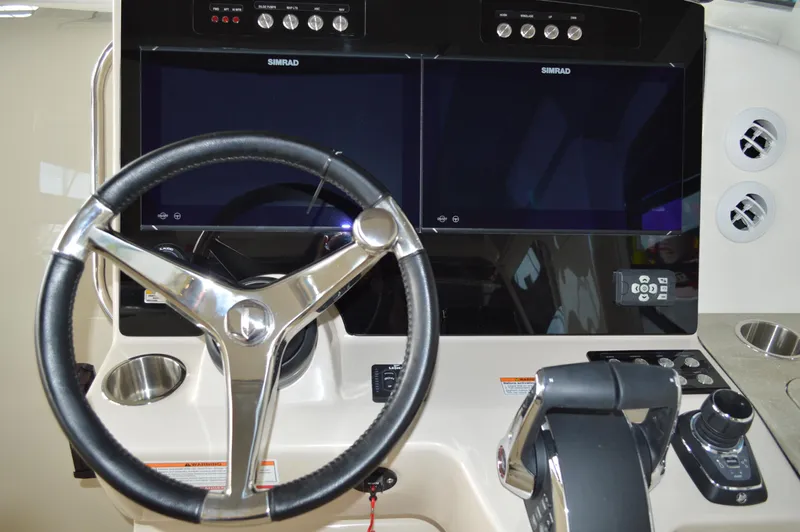  Yacht Photos Pics 2024 Boston Whaler 350 Realm helm with dual Simrad displays and steering wheel.