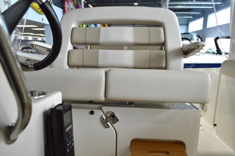  Yacht Photos Pics 2024 Boston Whaler 350 Realm interior seating, showcasing luxurious white upholstery and modern design.