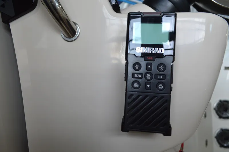  Yacht Photos Pics Simrad marine radio on 2024 Boston Whaler 350 Realm boat dashboard.