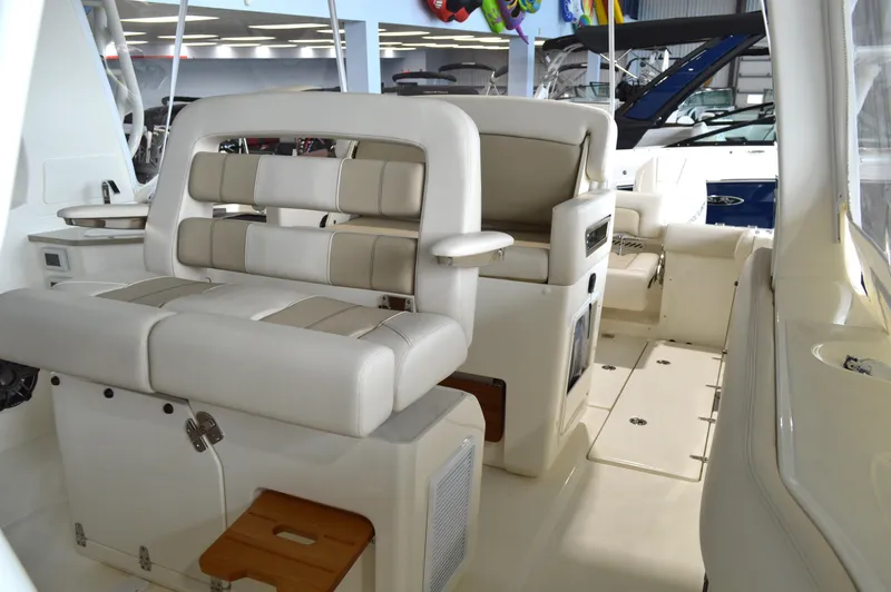  Yacht Photos Pics 2024 Boston Whaler 350 Realm interior with luxurious seating and modern design.