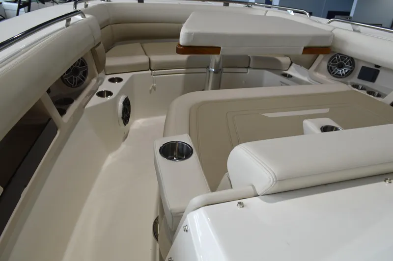  Yacht Photos Pics 2024 Boston Whaler 350 Realm interior with luxurious seating and cup holders.