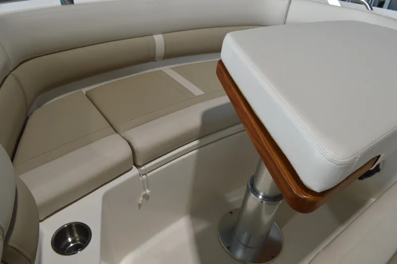  Yacht Photos Pics 2024 Boston Whaler 350 Realm interior with beige seating and table.