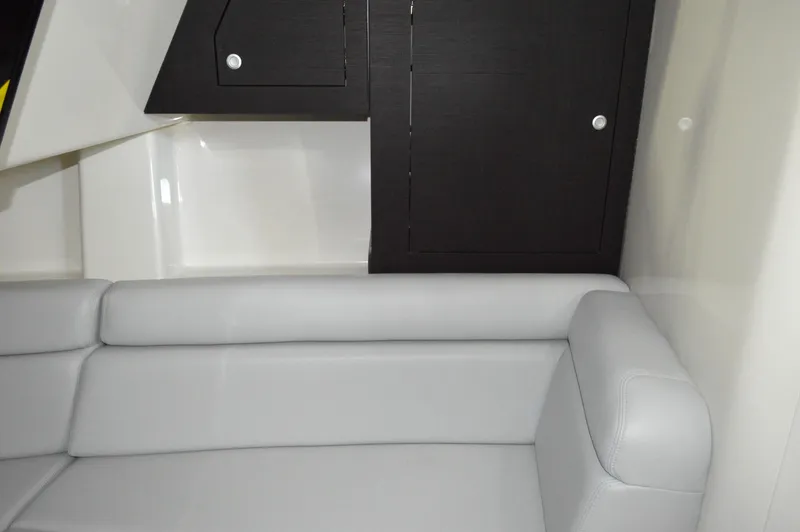  Yacht Photos Pics 2024 Boston Whaler 350 Realm interior with sleek cabinetry and comfortable seating.