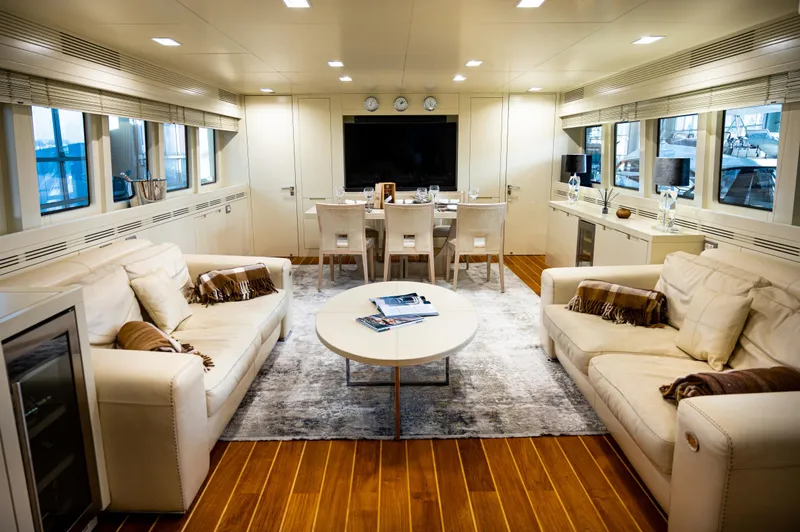  Yacht Photos Pics Luxurious interior of 2010 Benetti Sail Division 90 yacht with elegant seating and dining area.