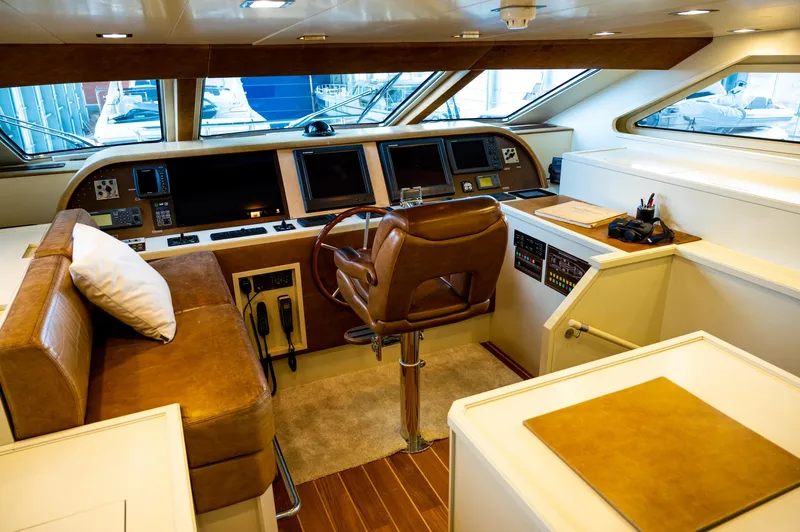  Yacht Photos Pics Luxurious helm of 2010 Benetti Sail Division 90 yacht with leather seating and advanced controls.
