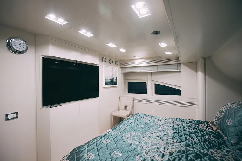  Yacht Photos Pics Luxurious bedroom interior of 2010 Benetti Sail Division 90 yacht with modern decor.
