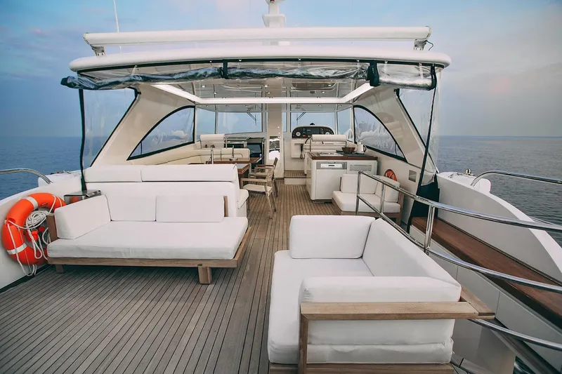  Yacht Photos Pics Luxurious 2010 Benetti Sail Division 90 yacht deck with elegant seating and ocean view.