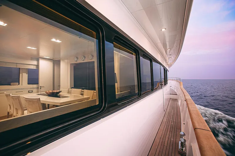  Yacht Photos Pics Luxury yacht Benetti Sail Division 90, 2010 model, cruising at sunset with elegant interior view.