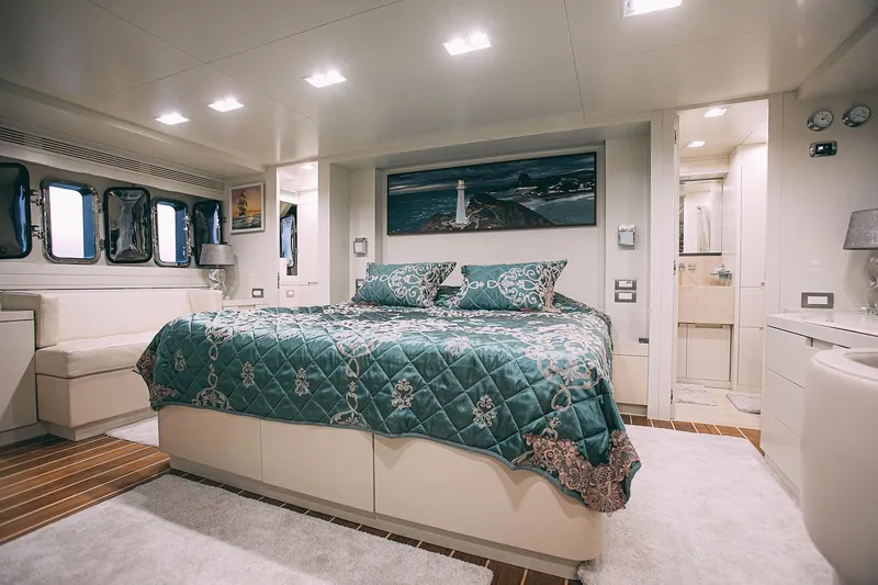  Yacht Photos Pics Luxurious bedroom interior of 2010 Benetti Sail Division 90 yacht with elegant decor.