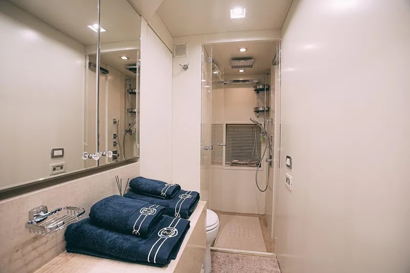  Yacht Photos Pics Luxurious bathroom on 2010 Benetti Sail Division 90 yacht with elegant fixtures and plush towels.