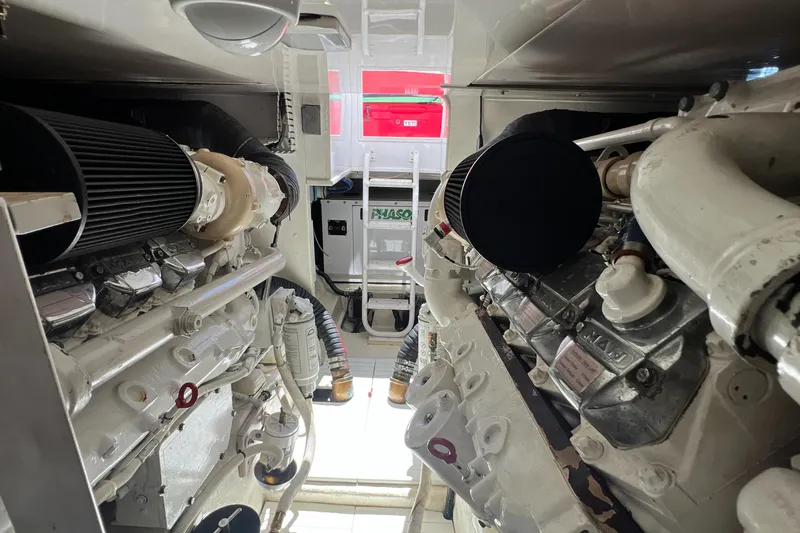 Dream On Yacht Photos Pics Engine room of a 2005 Bertram 450 yacht, showcasing dual engines and mechanical components.