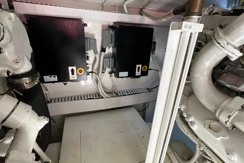 Dream On Yacht Photos Pics Engine room of a 2005 Bertram 450 yacht with electrical components and wiring.