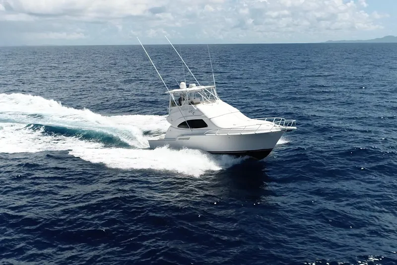 Dream On Yacht Photos Pics 2005 Bertram 450 yacht cruising on open ocean under clear skies.