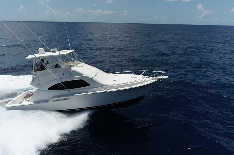 Dream On Yacht Photos Pics 2005 Bertram 450 yacht cruising on open ocean under clear sky.