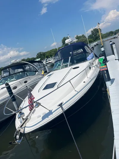  Yacht Photos Pics 2006 Sea Ray 320 Sundancer docked at marina under clear blue sky.