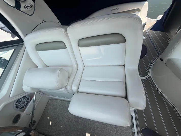  Yacht Photos Pics Interior seating of a 2006 Sea Ray 320 Sundancer boat, featuring white leather upholstery.