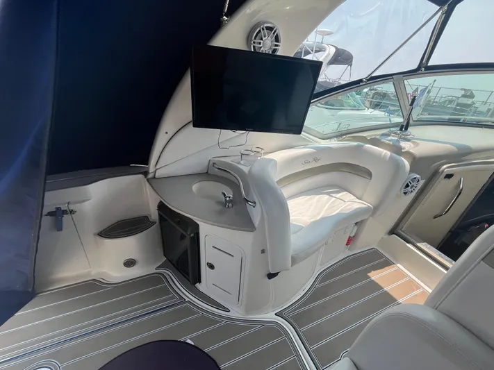  Yacht Photos Pics Interior of 2006 Sea Ray 320 Sundancer with seating, TV, and sleek design.