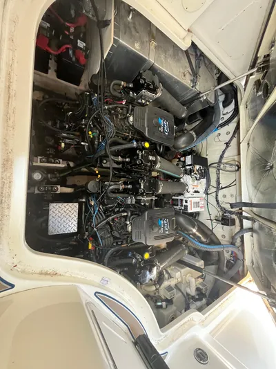  Yacht Photos Pics Engine compartment of 2006 Sea Ray 320 Sundancer, showcasing dual engines and wiring.